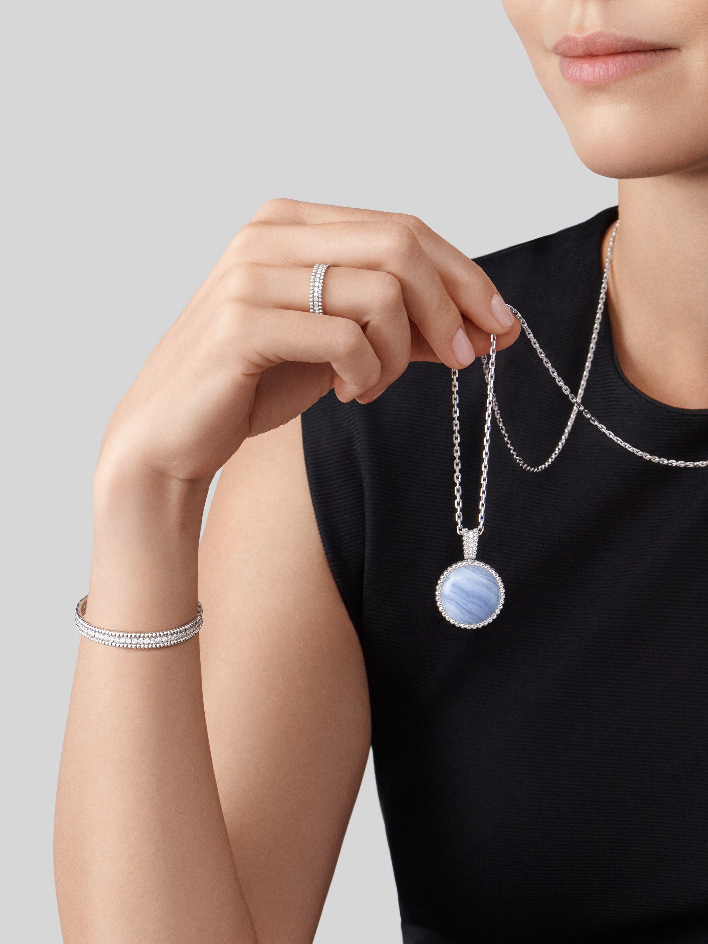 Perlée secret pendant watch, 18K white gold, Chalcedony:  1 stone, Diamond:  40 stones,  0.92 carat, Mother-of-pearl:  1 stone, Worn Detail, Watch - Van Cleef & Arpels