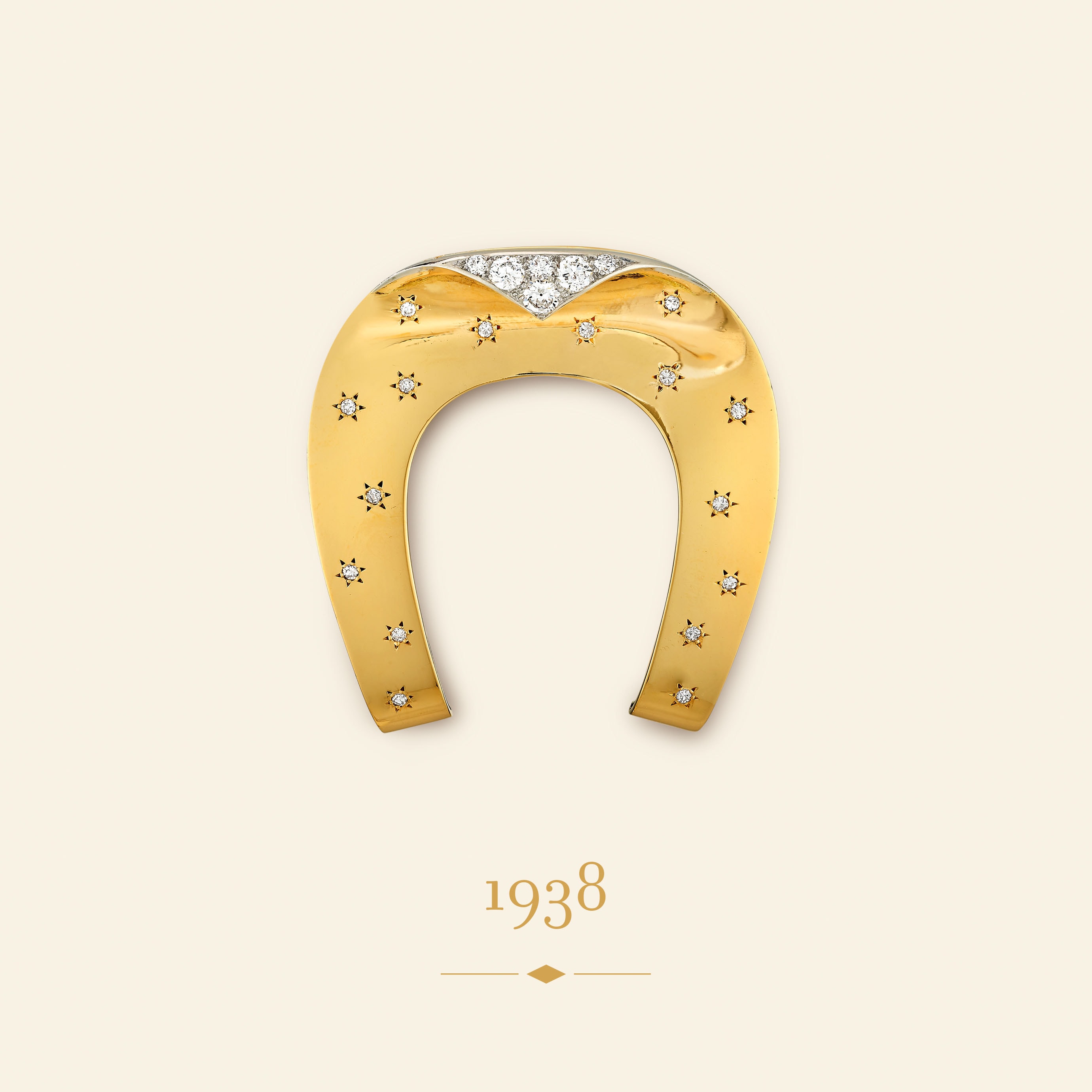 Horseshoe clip, 1938​. Yellow gold, platinum, diamonds​. Van Cleef & Arpels Collection.
