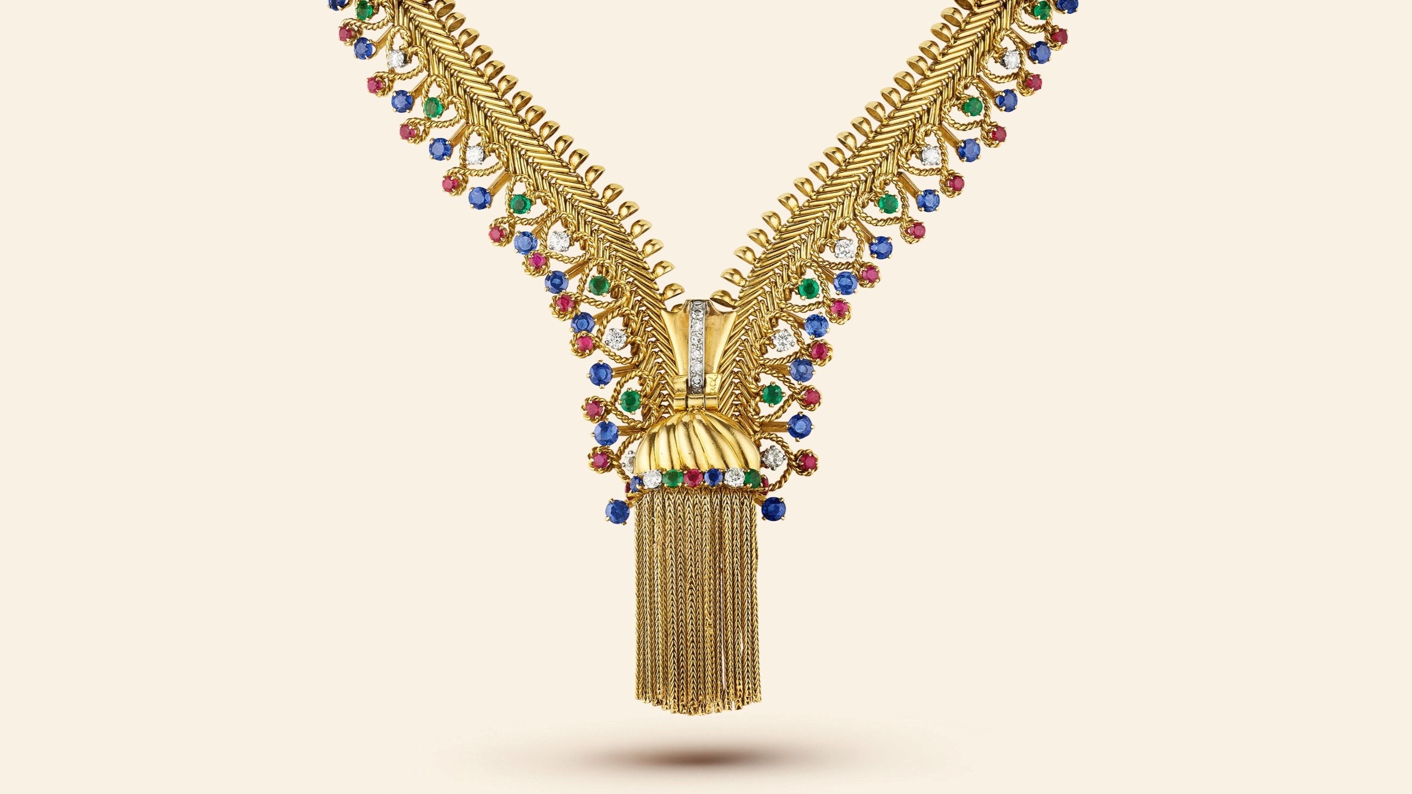 Zip necklace, 1954​. Transformable into a bracelet​. Yellow gold, platinum, emeralds, rubies, sapphires, diamonds​. Van Cleef & Arpels Collection.