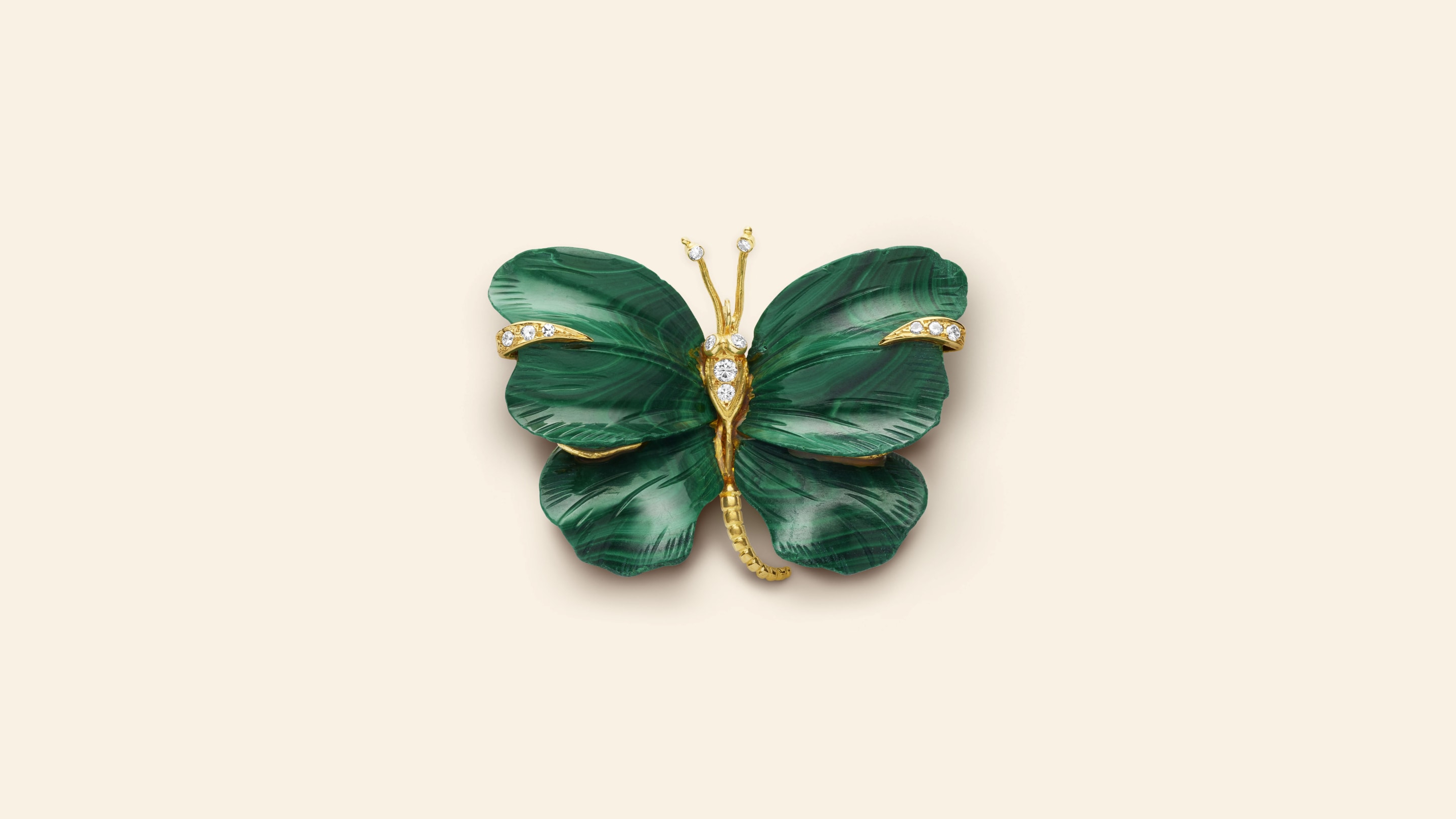 Butterfly clip, circa 1971​. Yellow gold, white gold, malachite, diamonds​. Van Cleef & Arpels Collection.