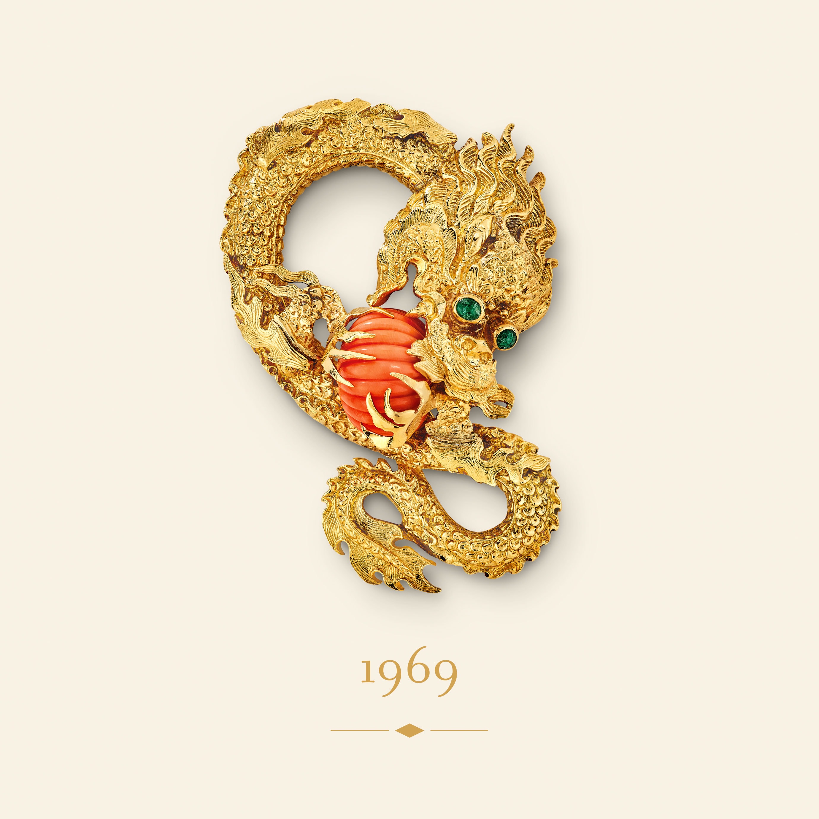 Dragon clip, 1969​. Yellow gold, emeralds, coral​. Van Cleef & Arpels Collection.