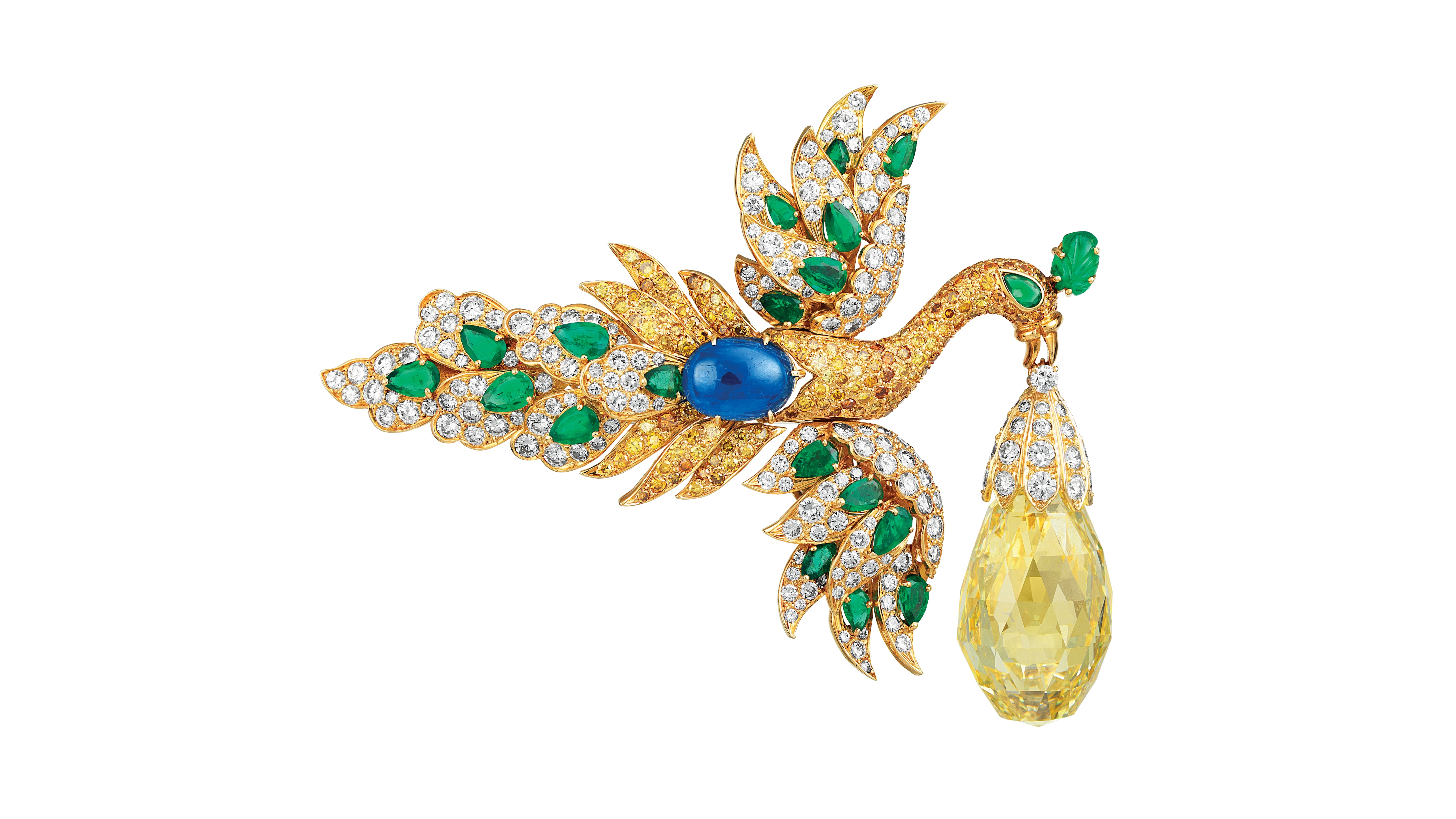 Bird clip and Walska pendant, 1971. The tail turns into a clip, the wings into earrings and the briolette-cut diamond may be worn as a pendant. 18K yellow gold, emeralds, sapphire, yellow diamonds, diamonds. Van Cleef & Arpels Collection.