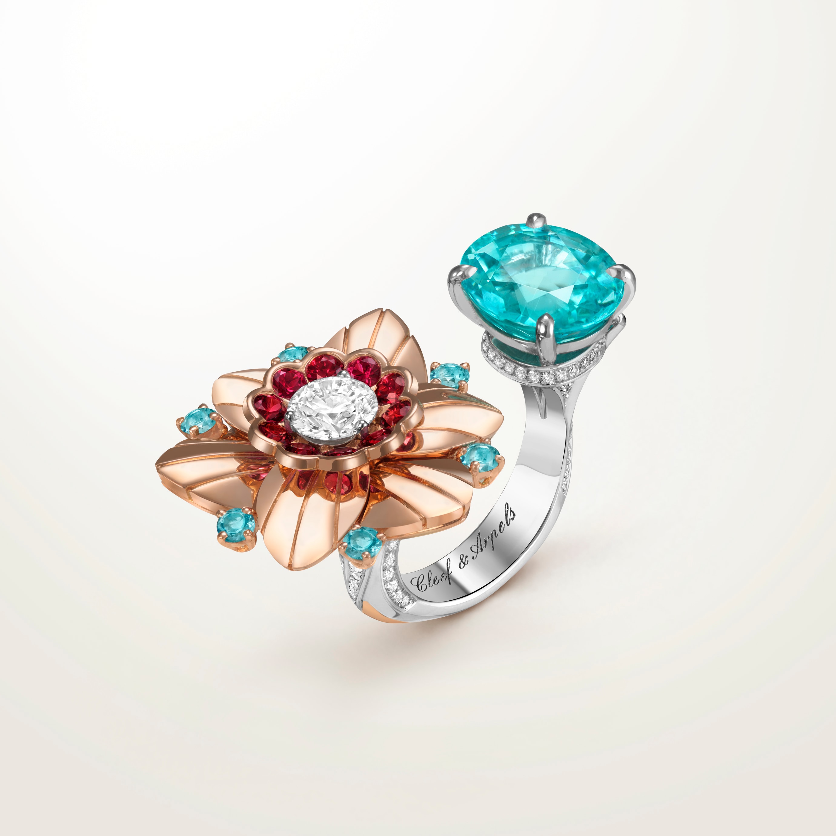 Jonquille Between the Finger ring  Rose gold, white gold, one oval-cut blue tourmaline of 5.27 carats, rubies, blue tourmalines, diamonds. Signature collections, Van Cleef & Arpels.