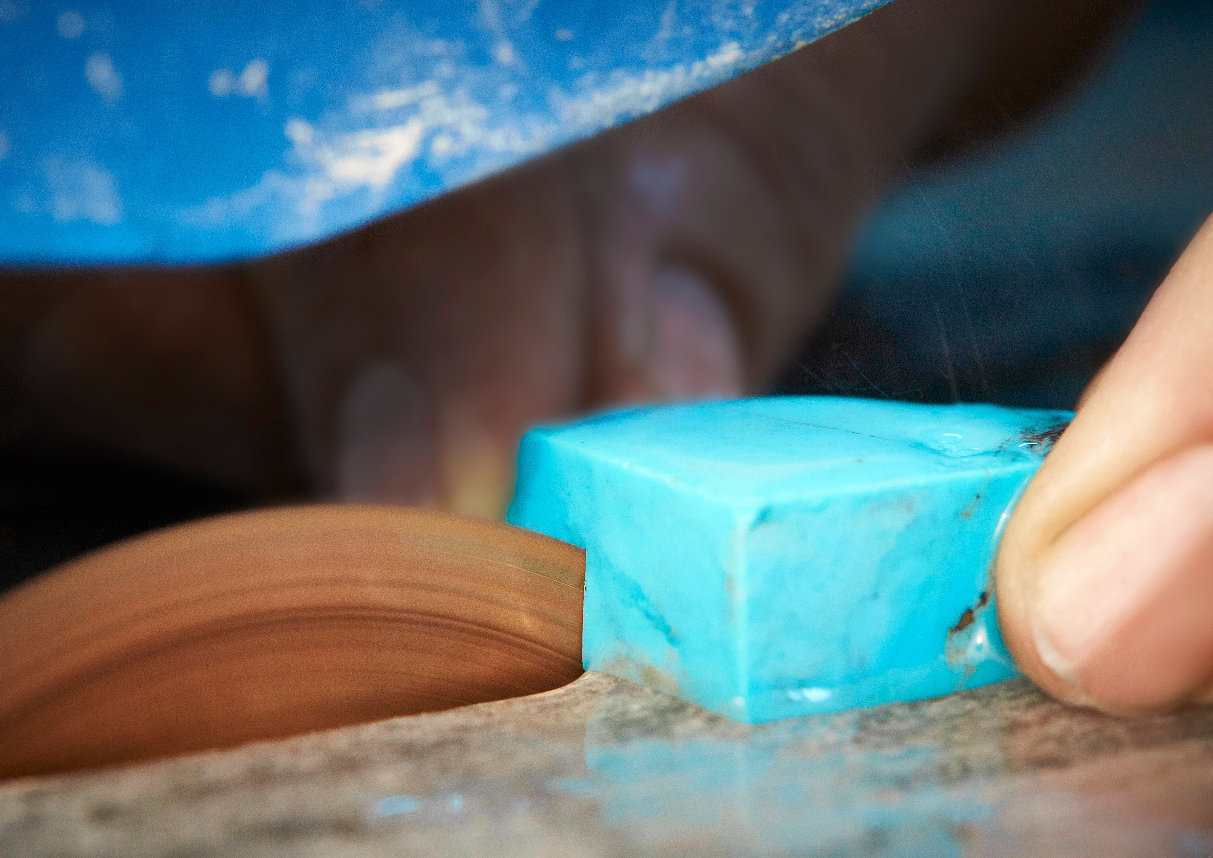 Cutting the rough turquoise stone. Van Cleef & Arpels.