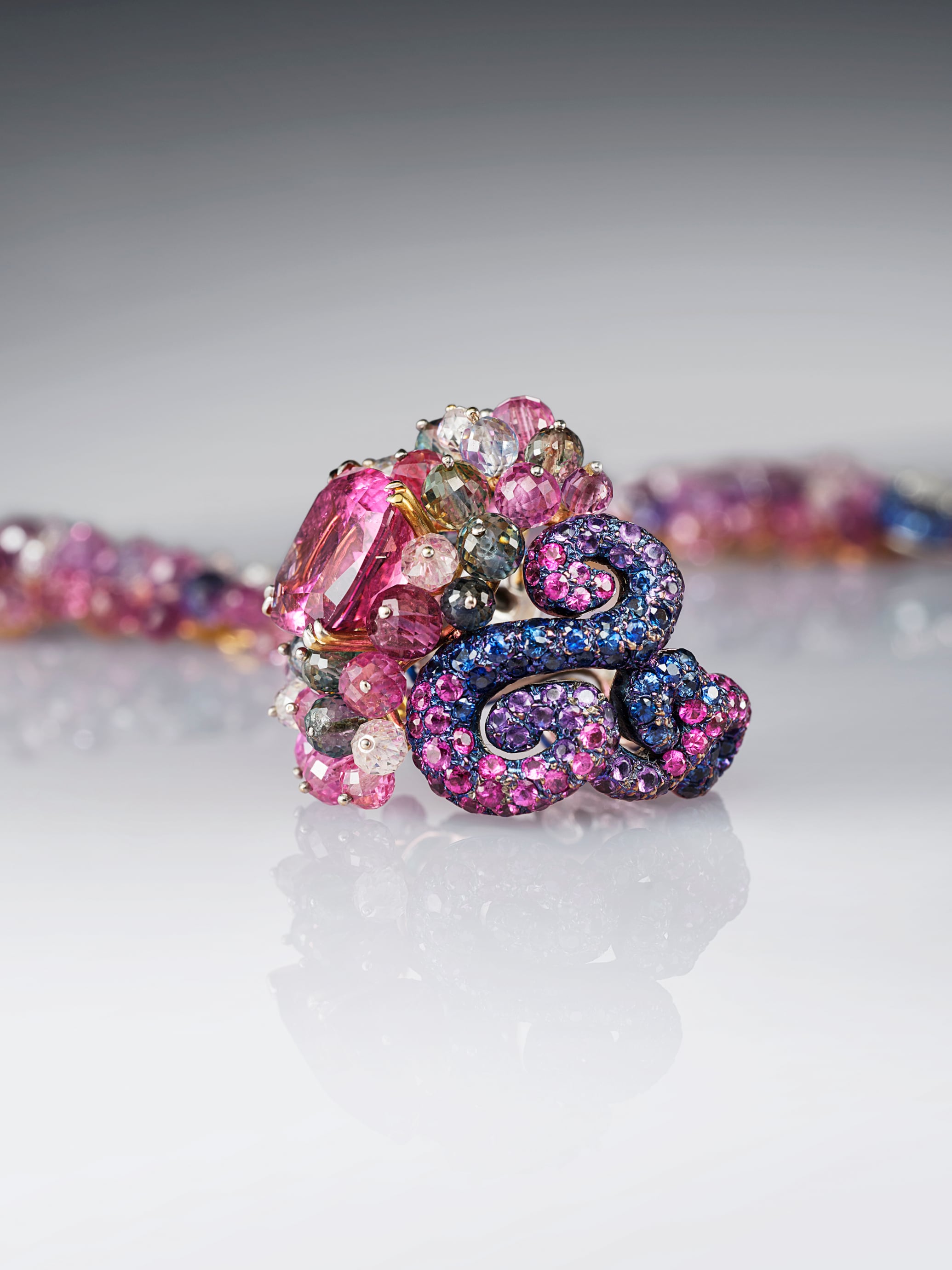 Tourmaline ring by Carnet, 21st century. Pink tourmaline, colored sapphires, titanium, and platinum, The Illuminata Collection, L'ÉCOLE Van Cleef & Arpels, photo: Picspark Co​