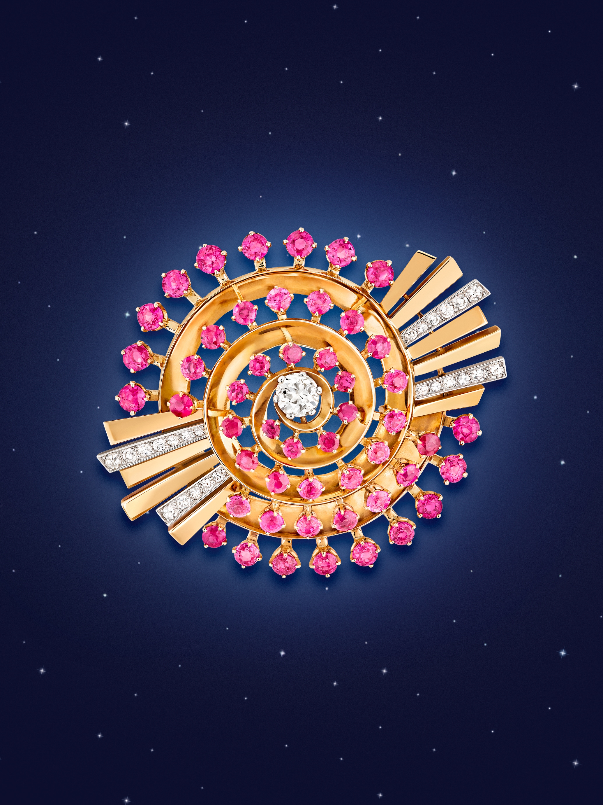 Spiral clip, 1942, platinum, yellow gold, rose gold, rubies, diamonds. Van Cleef & Arpels Collection