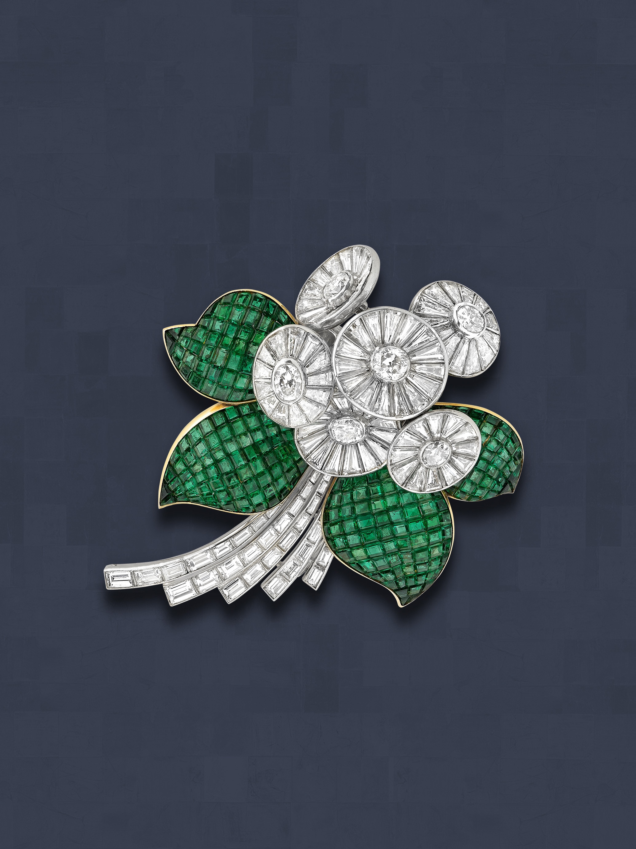 Flower brooch, 1938. Platinum, white gold, yellow gold, Mystery Set emeralds, diamonds. Van Cleef & Arpels Collection.