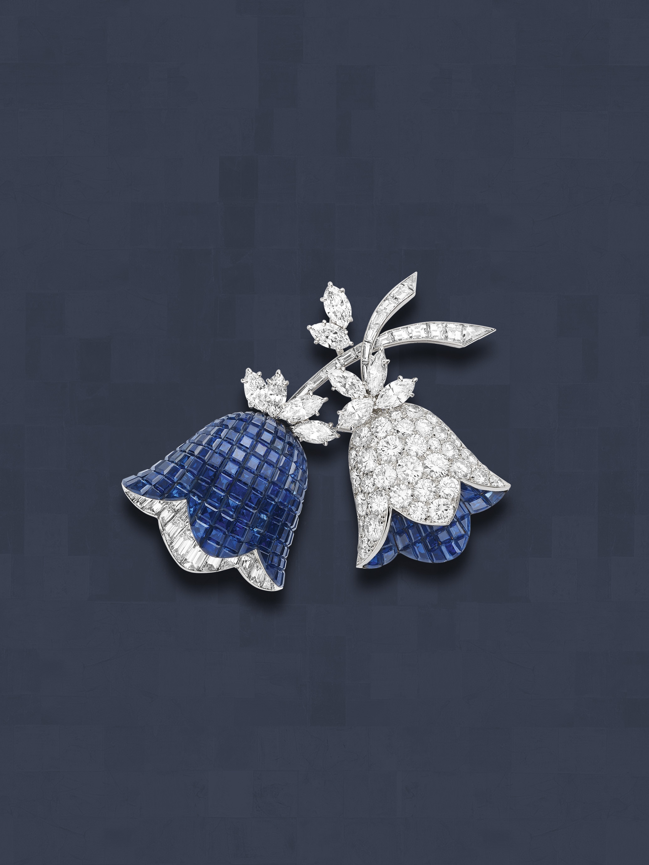 Bellflower clip, 1969. Platinum, yellow gold, Mystery Set sapphires, diamonds. Van Cleef & Arpels Collection.