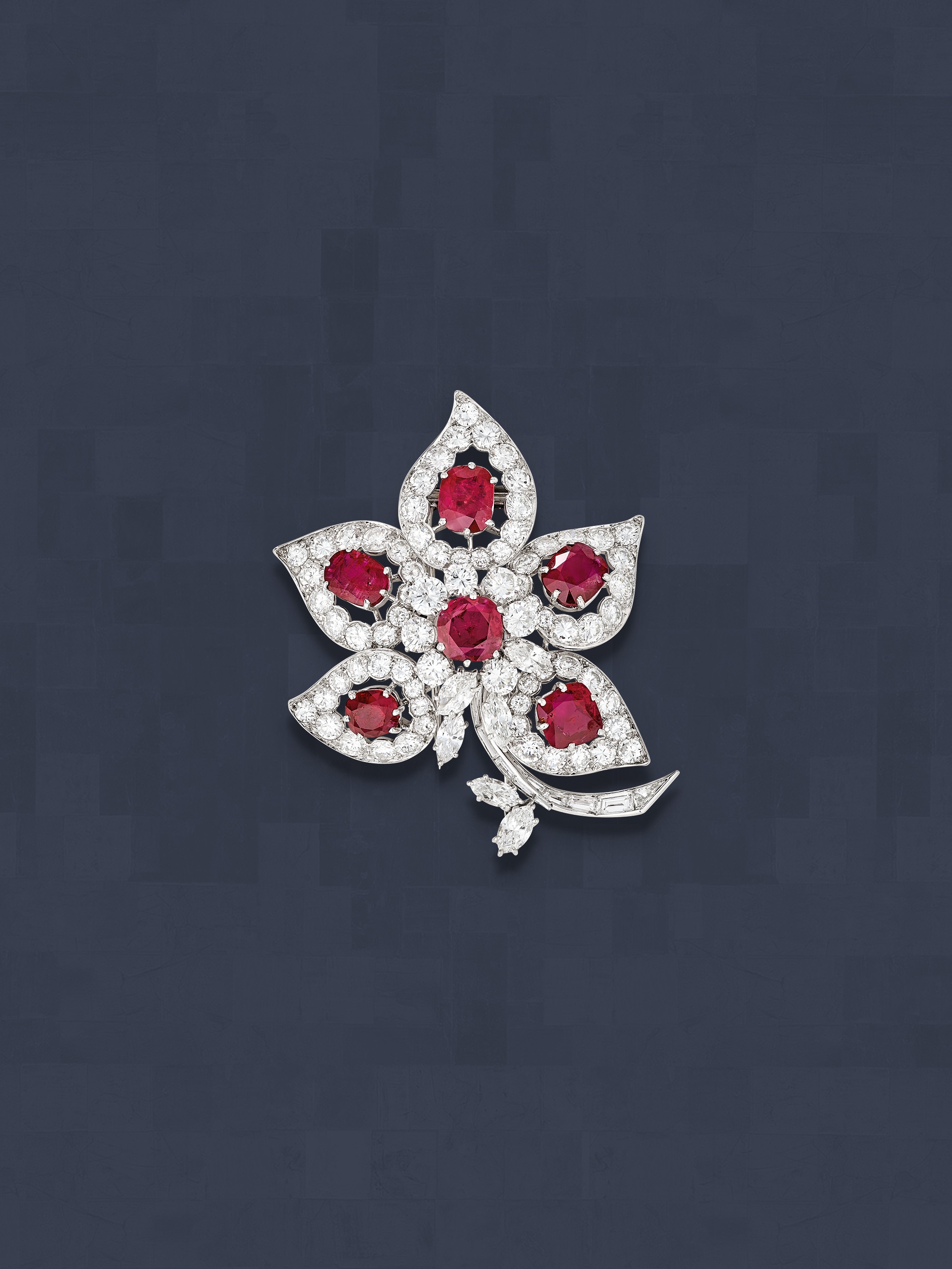 Five-leaf clip, 1965. Platinum, rubies, diamonds. Former collection of opera singer Maria Callas. Van Cleef & Arpels Collection.