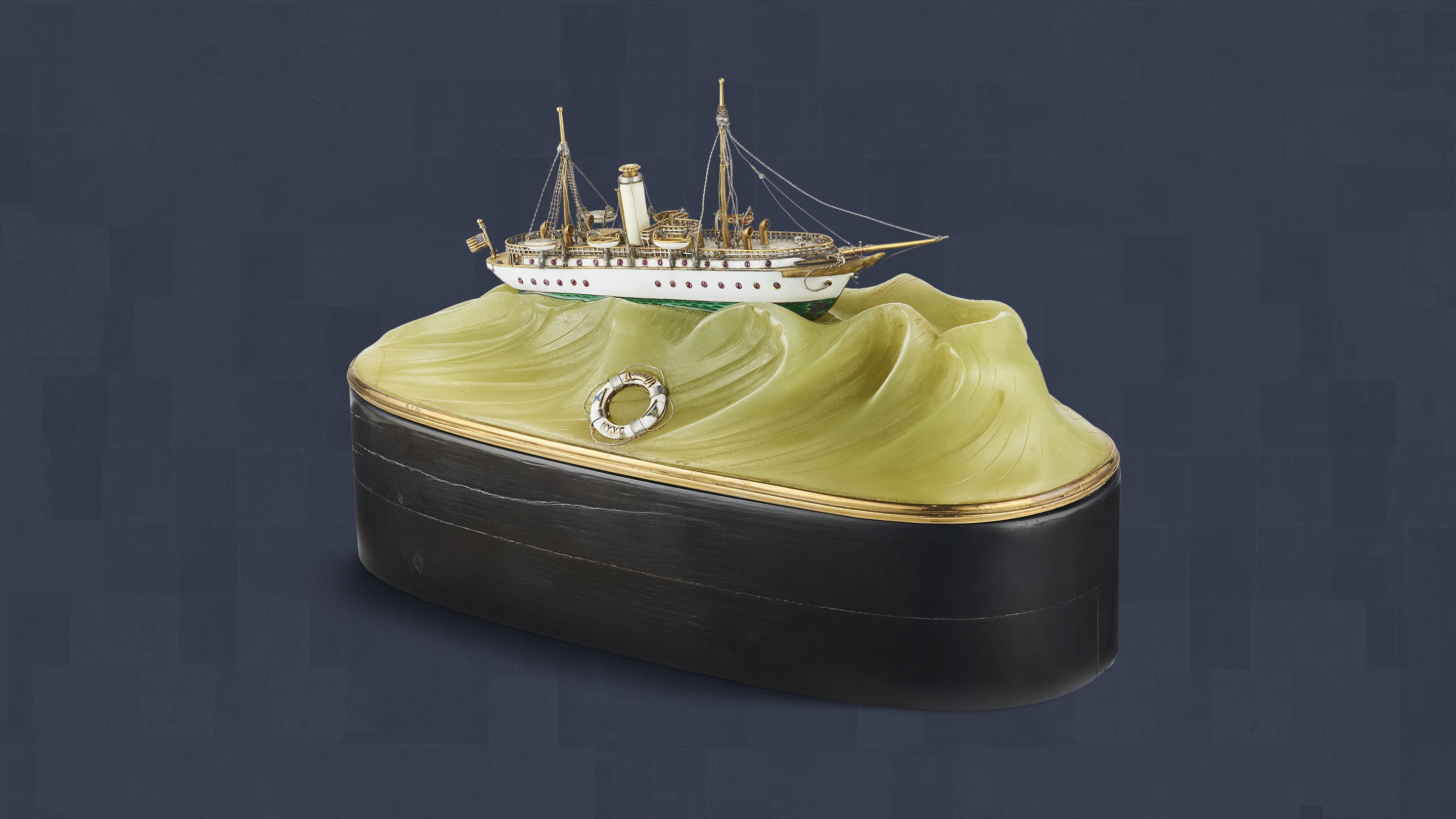 Small-scale reproduction of the Varuna yacht, 1906. Yellow gold, silver, jasper, ebony, enamel. Van Cleef & Arpels Collection.