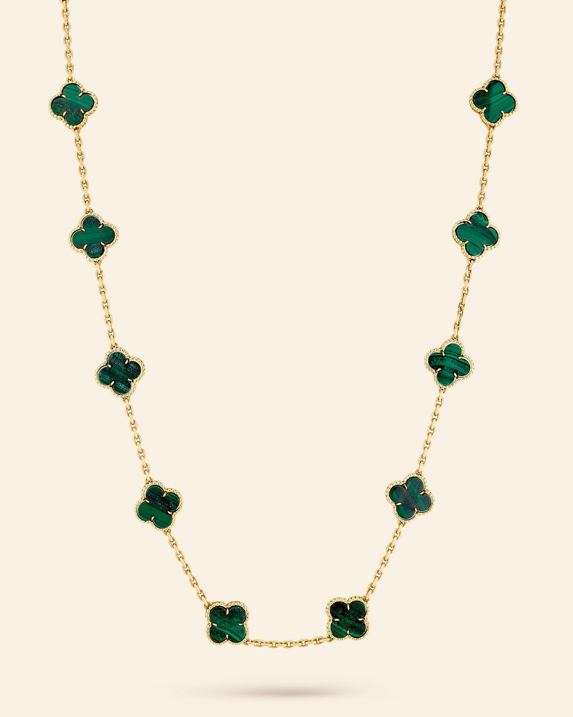 Alhambra long necklace, 1973​. Yellow gold, malachite​. Van Cleef & Arpels Collection​.