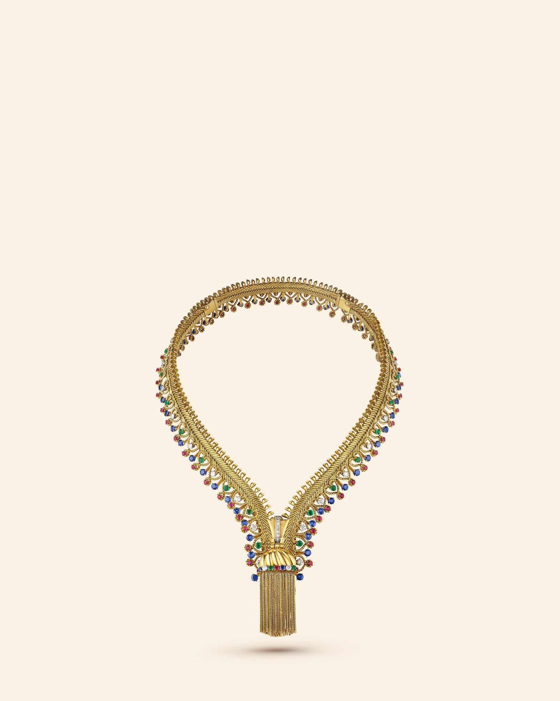 Zip necklace, 1954​. Transformable into a bracelet​. Yellow gold, platinum, emeralds, rubies, sapphires, diamonds​. Van Cleef & Arpels Collection.