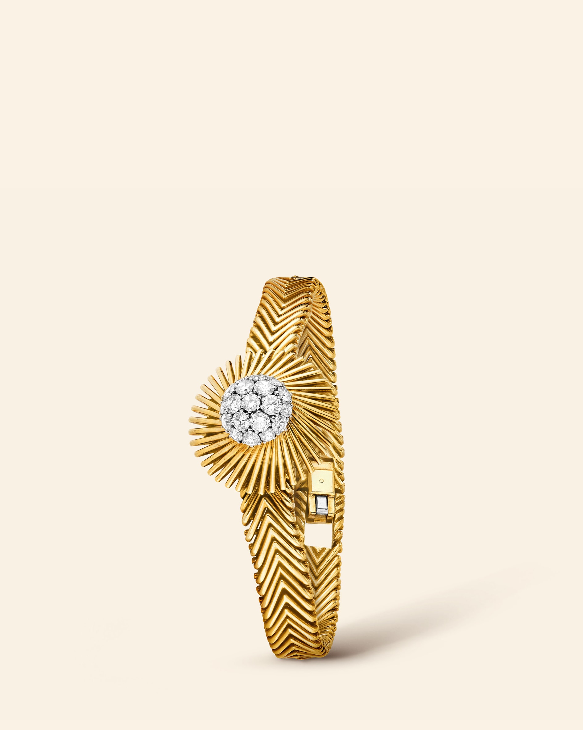Meteor secret wristwatch, 1959​. Yellow gold, platinum, diamonds​. Van Cleef & Arpels Collection​.