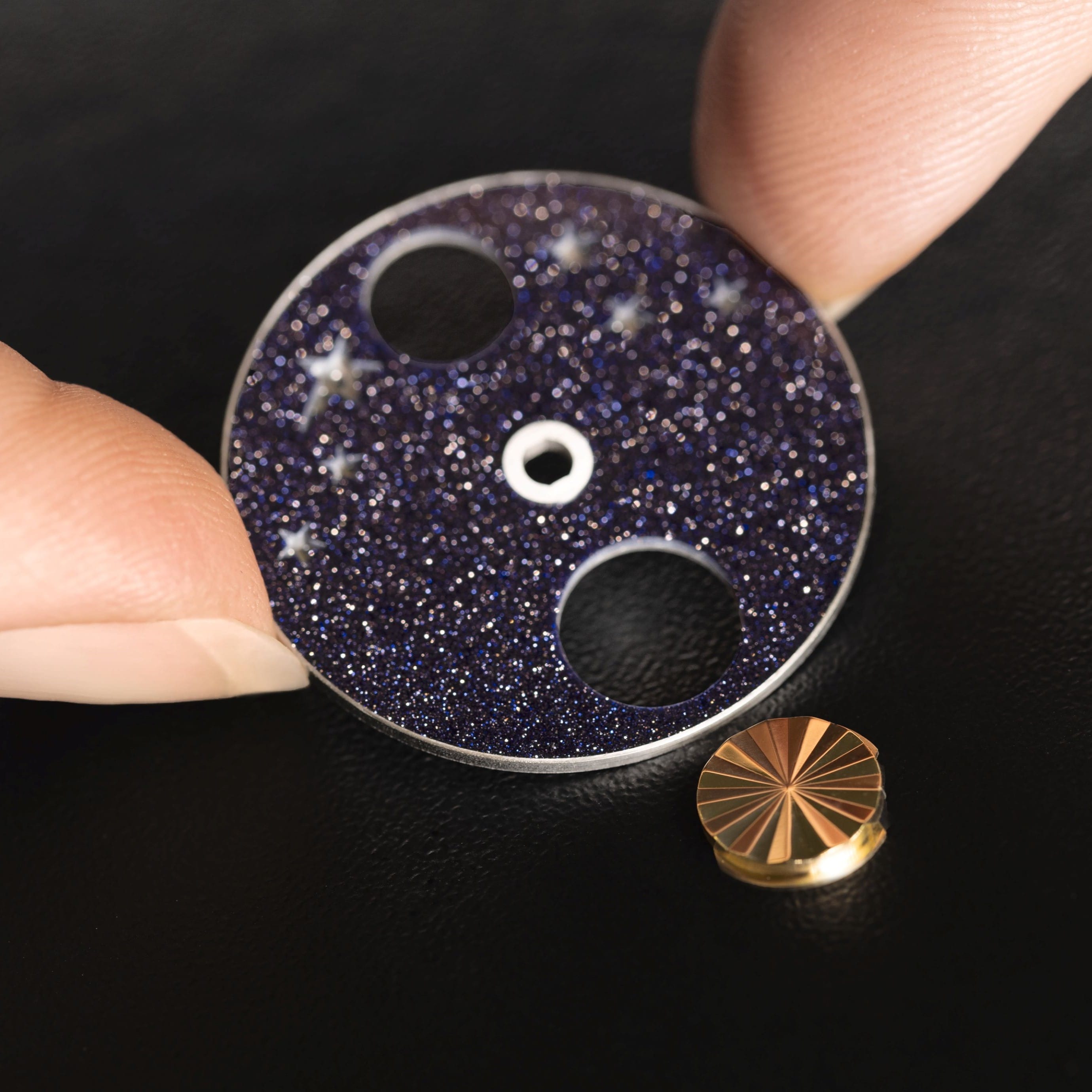 Fitting the yellow gold guilloché sun in the aventurine glass disc, Lady Jour Nuit watch, Poetic Complications® collection, Van Cleef & Arpels.