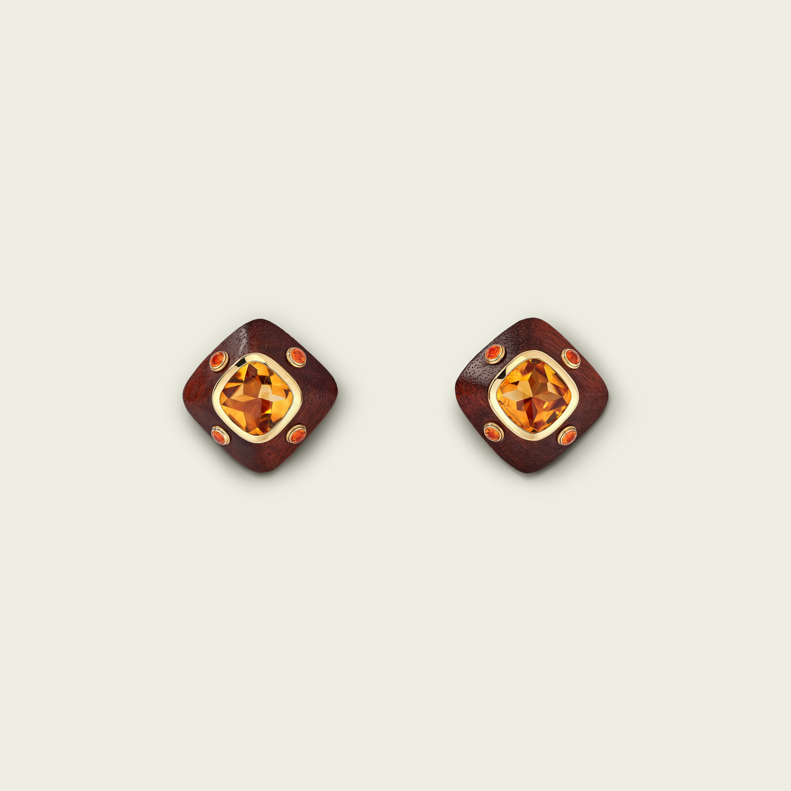 Emotion earrings, 1997. Yellow gold, citrines, garnets, wood. Van Cleef & Arpels Collection.