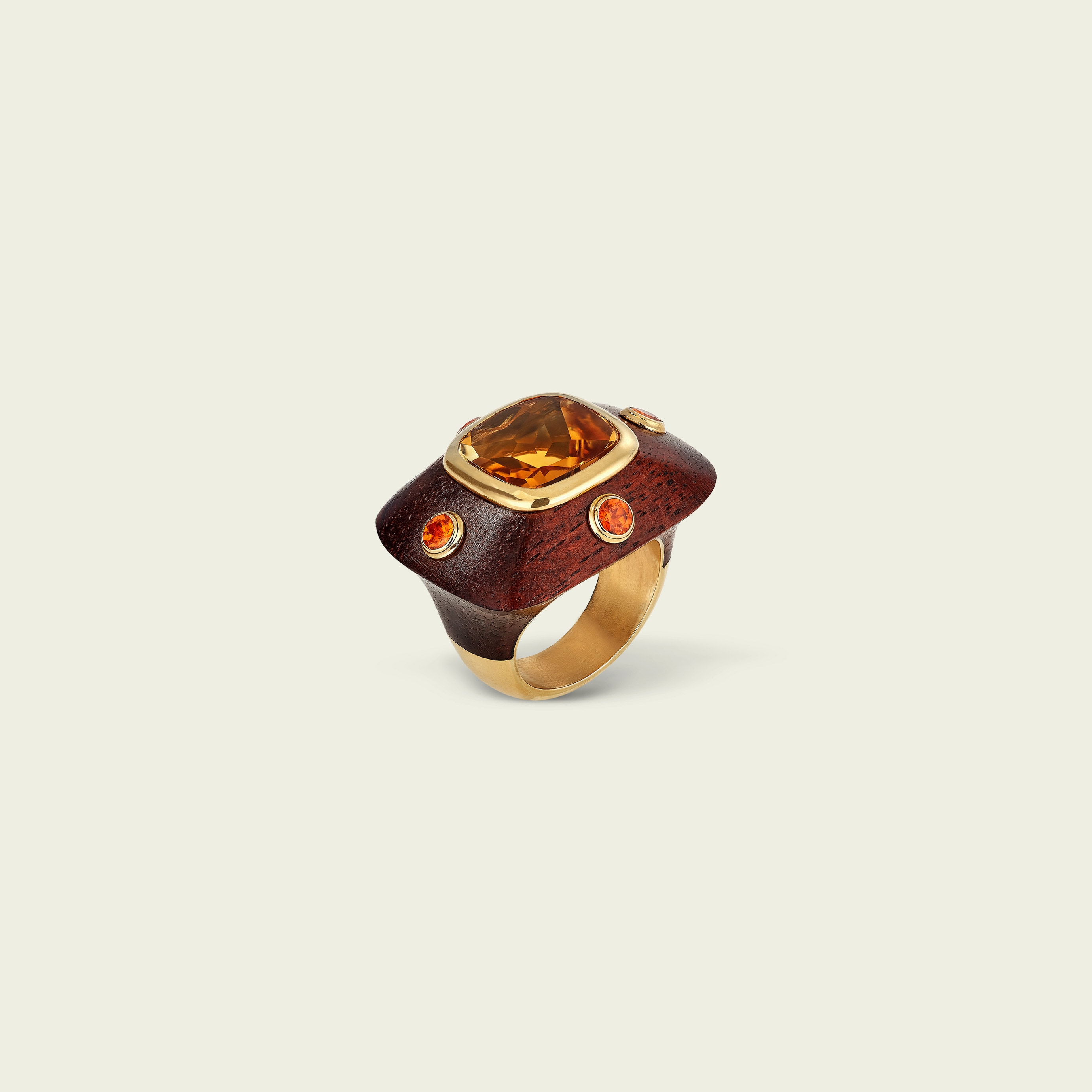 Emotion ring, 1997. Yellow gold, citrines, garnets, wood. Van Cleef & Arpels Collection.