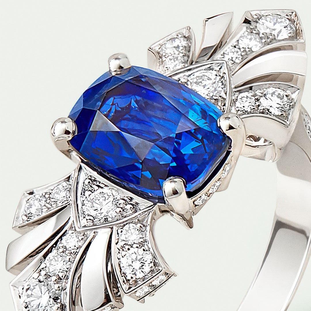 Eventails solitaire, platinum, round diamonds, one emerald-cut sapphire. High Jewelry Solitaires collection, Van Cleef & Arpels.