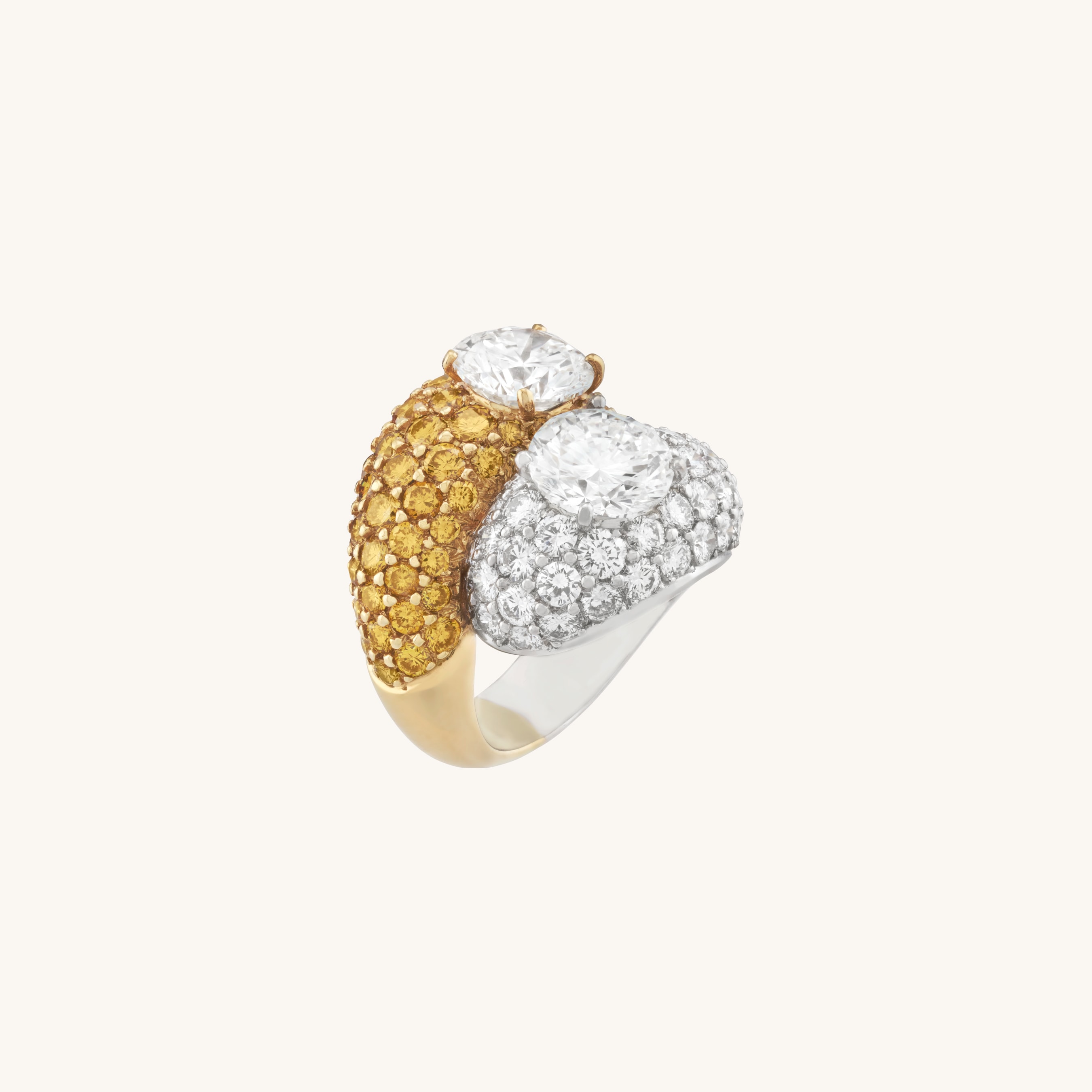 Ring, 1995, platinum, yellow gold, one round diamond of 2.08 carats, one round diamond of 2.01 carats, yellow and white diamonds. Heritage collection, Van Cleef & Arpels.