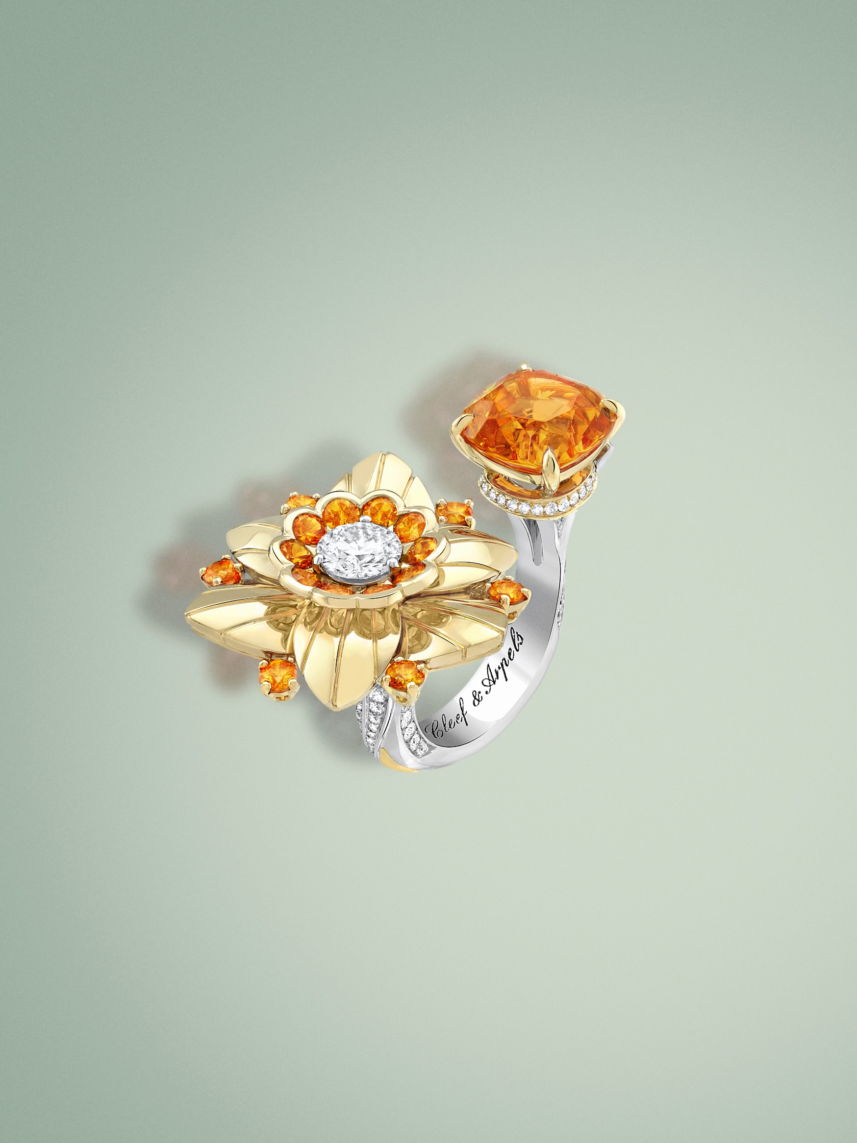 Jonquille Between the Finger ring. 18K yellow gold, 18K white gold, one cushion-cut spessartite garnet of 6.57 carats, spessartite garnets, diamonds. Flowers collection, Van Cleef & Arpels.