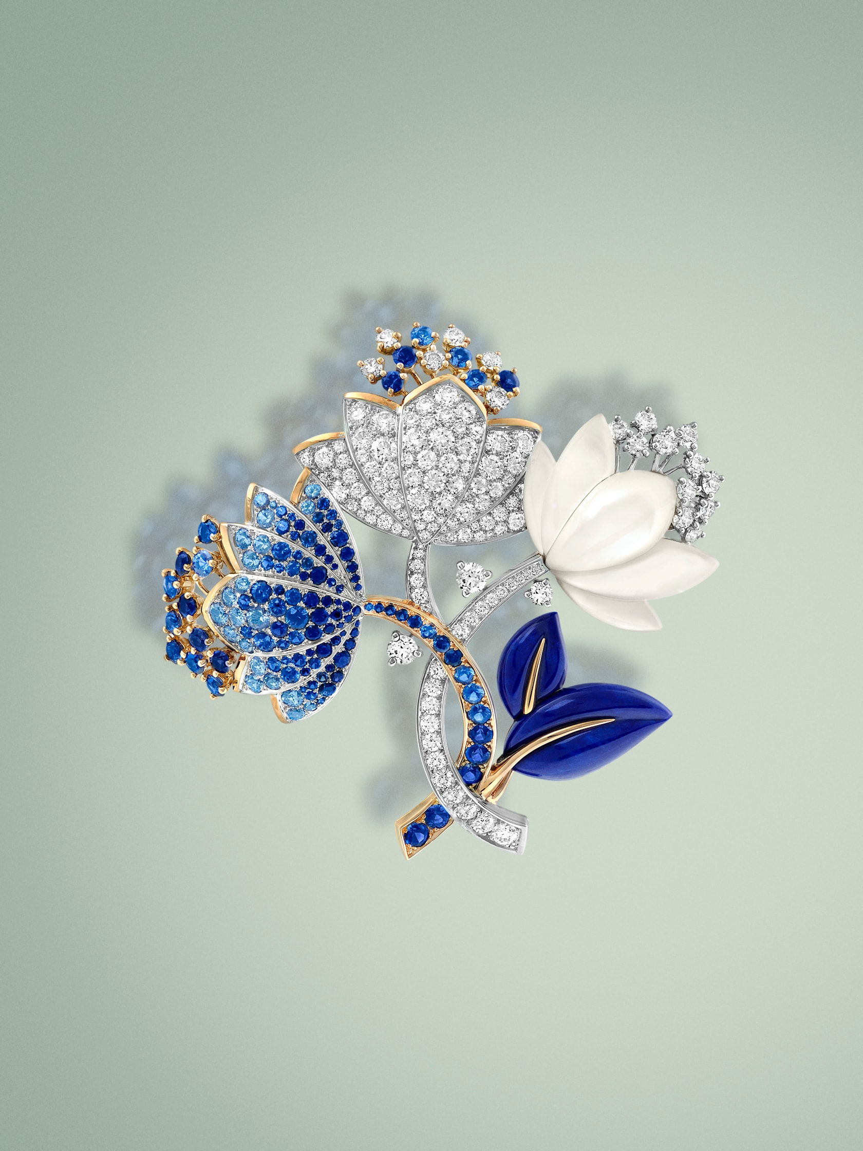 Amaryllis clip. 18K rose gold, 18K white gold, sapphires, white mother-of-pearl, lapis-lazuli, diamonds.. Flowers collection, Van Cleef & Arpels.