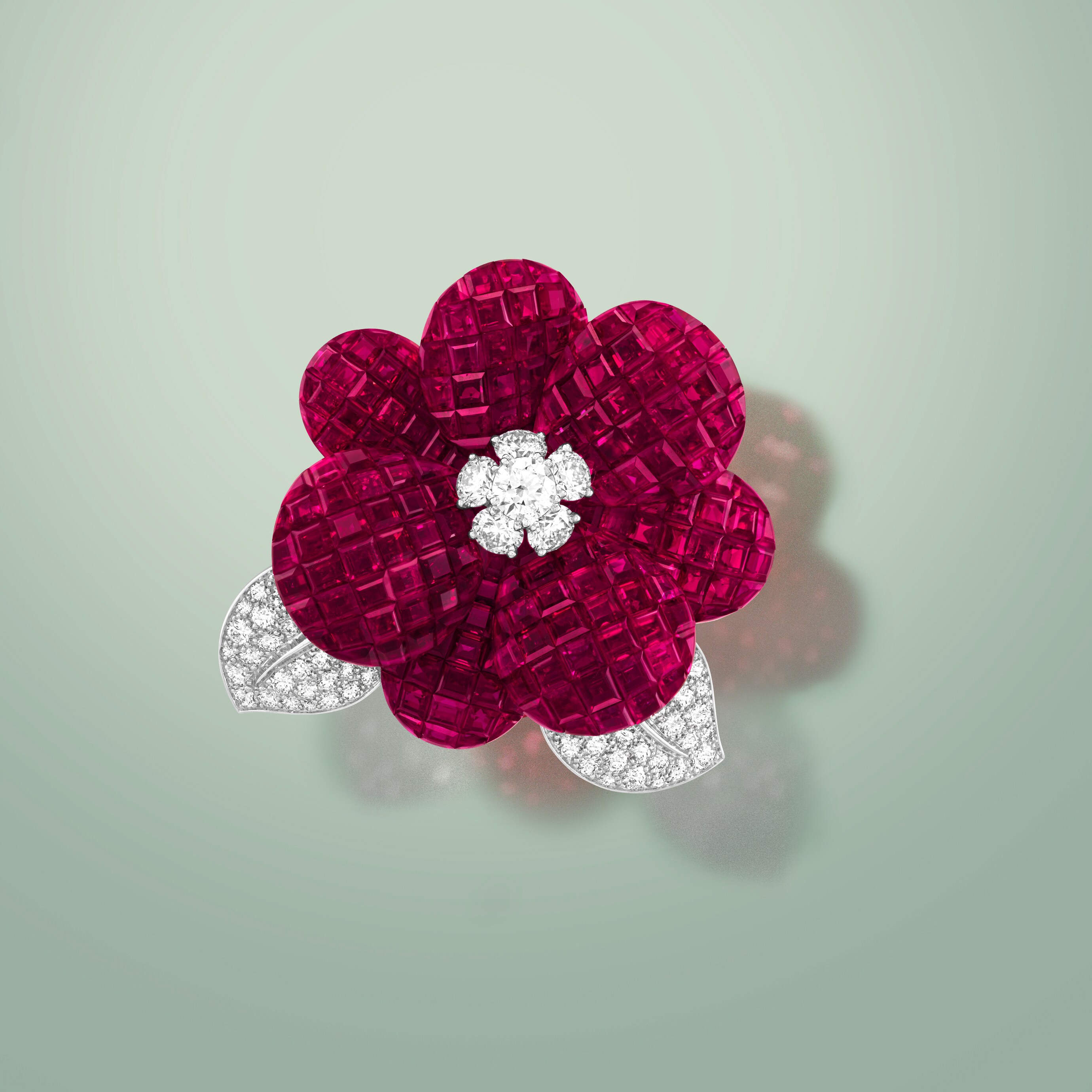 Grand Pavot clip. Platinum, 18K rose gold, 18K white gold, Traditional Mystery Set™ rubies, diamonds.. Flowers collection, Van Cleef & Arpels.