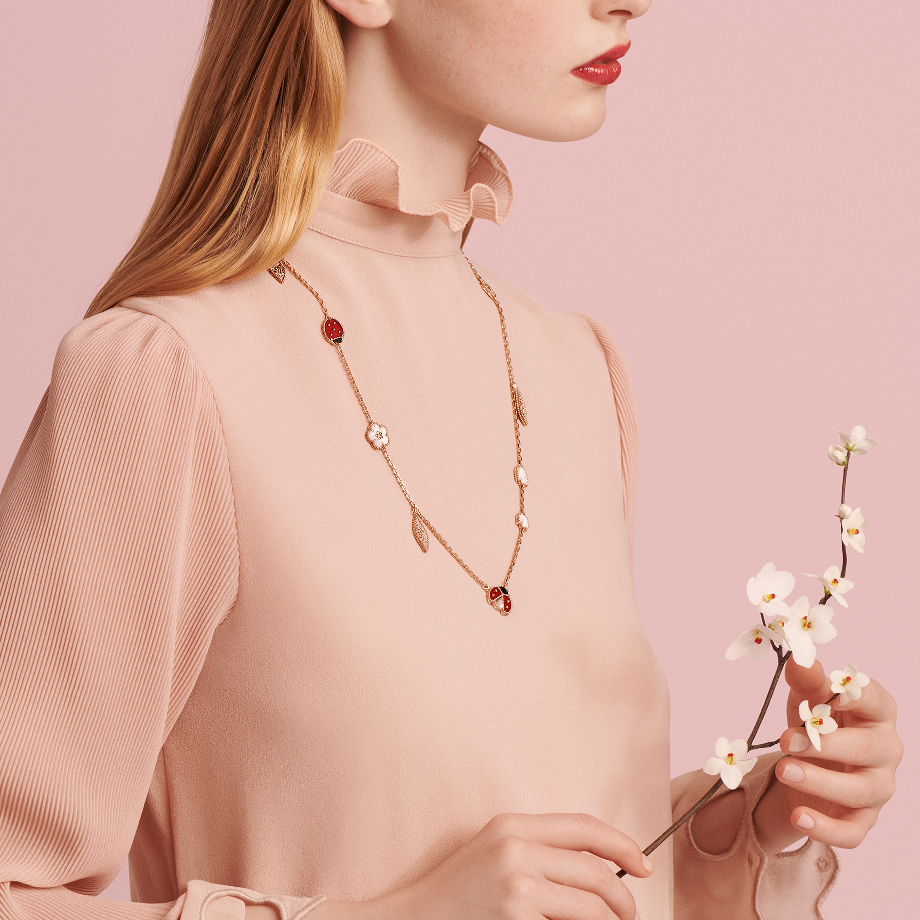 Lucky Spring long necklace, 15 motifs, rose gold, white mother-of-pearl, carnelian, onyx. Lucky Spring collection, Van Cleef & Arpels