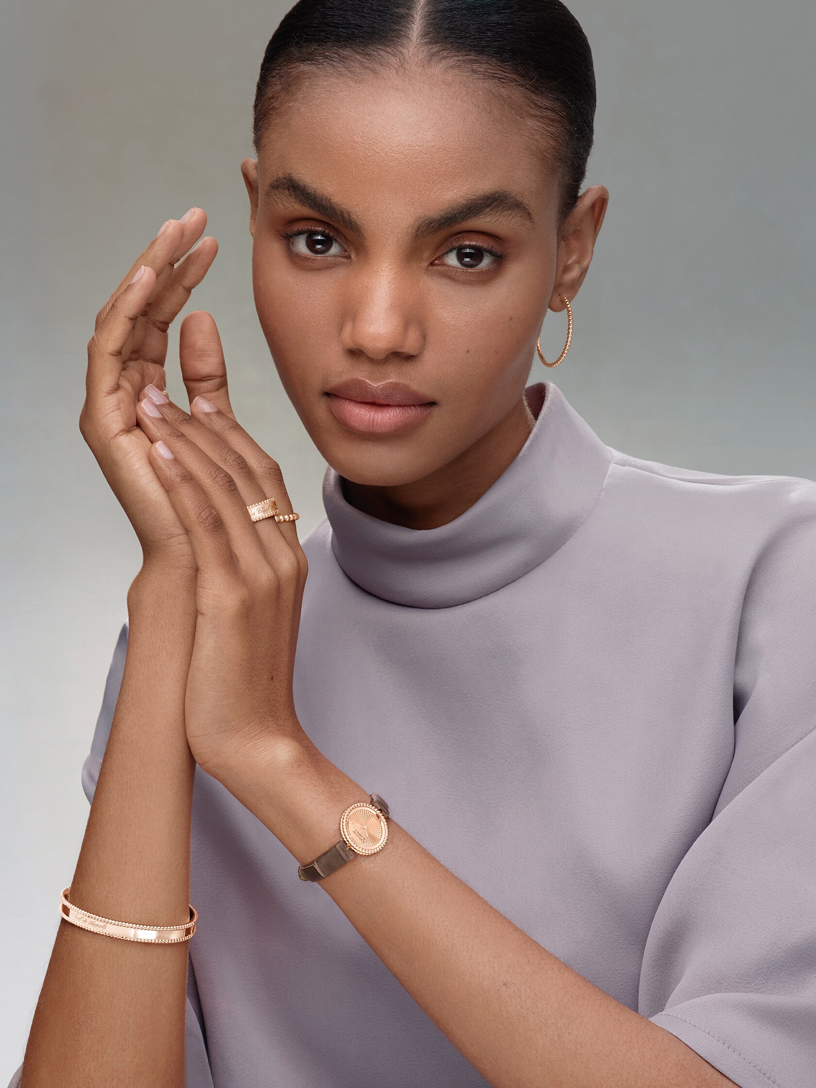 Signature bracelet and pearls of gold ring, 18K rose gold, medium model, signature ring, 18K rose gold, pearls of gold hoop earrings, small model, watch, 23 mm, 18K rose gold, guilloché 18K rose gold, Swiss quartz movement. Perlée collection, Van Cleef & Arpels.