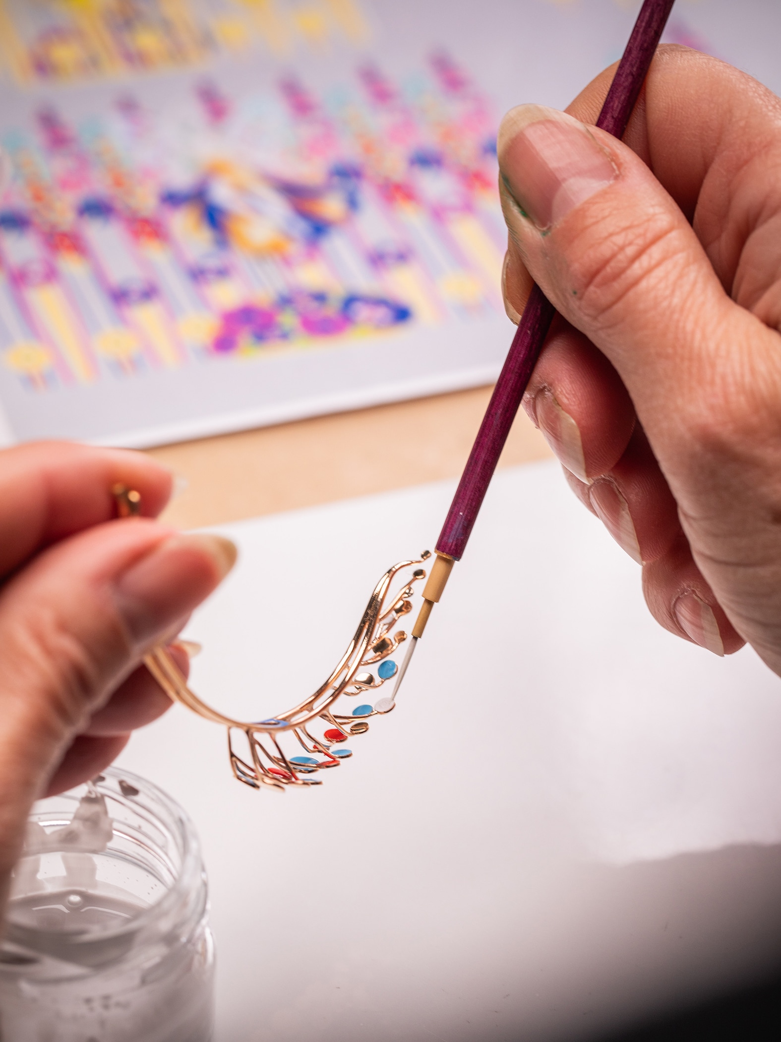 Applying the lacquer on the rose gold tips. Bouton d'Or automaton, Extraordinary Objects collection, Van Cleef & Arpels.