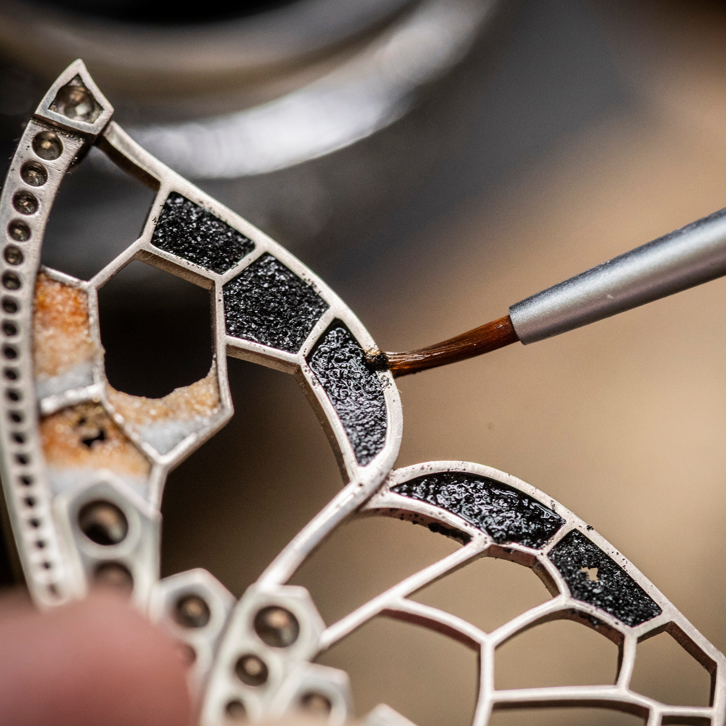 Applying enamel with the plique-à-jour technique on the butterfly’s wing, Van Cleef & Arpels.