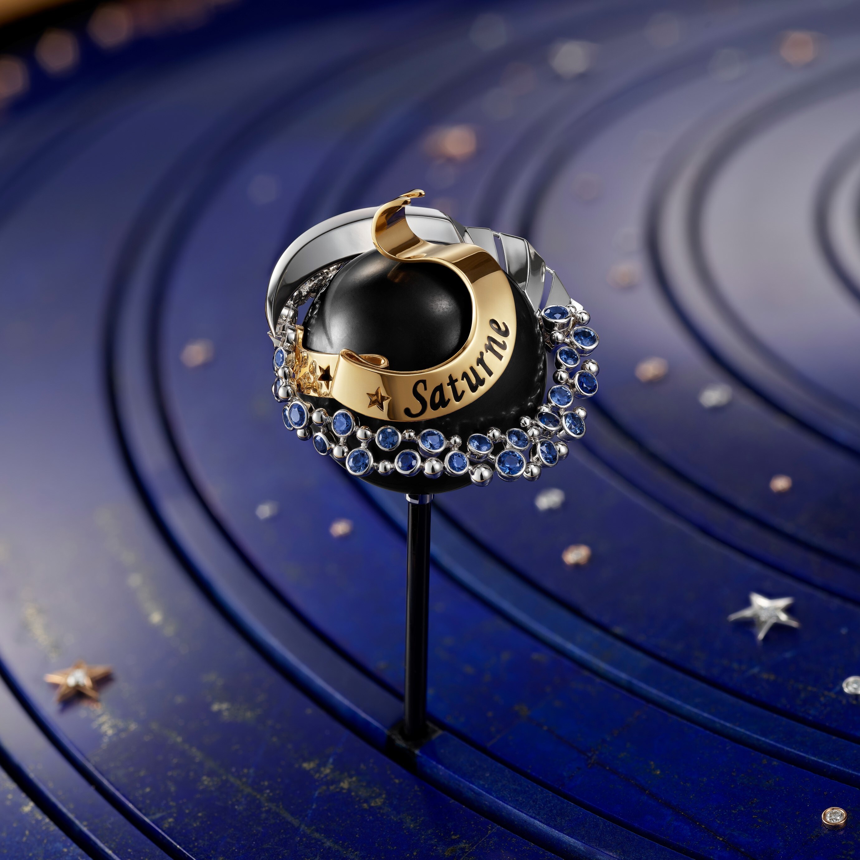 Saturn in white and yellow gold, blue sapphires, jet and diamonds, Van Cleef & Arpels.