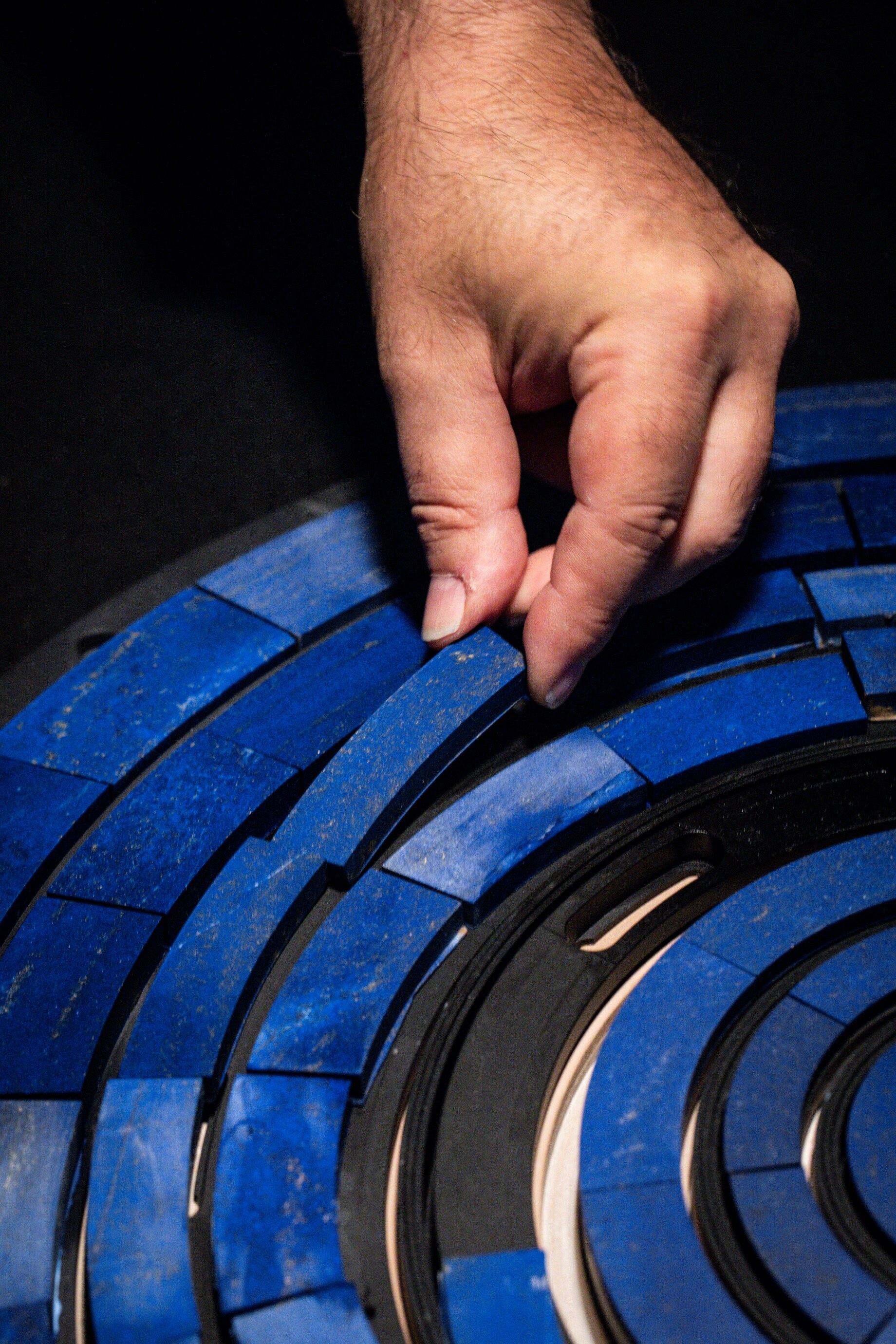 Adjusting lapis lazuli patterns, Van Cleef & Arpels.