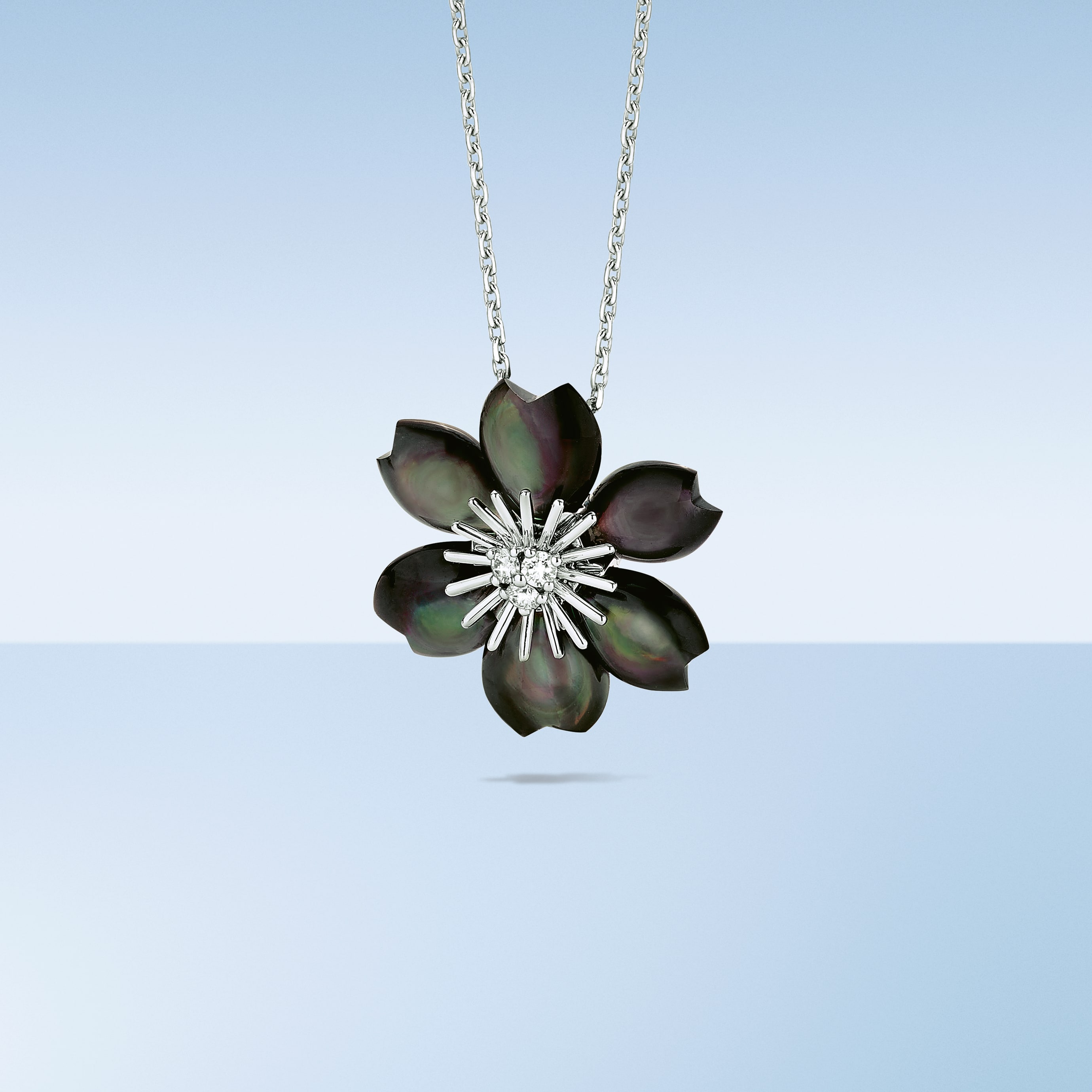 Rose de Noël pendant rhodium plated 18K white gold, grey mother-of-pearl, diamonds. Rose de Noël collection, Van Cleef & Arpels.