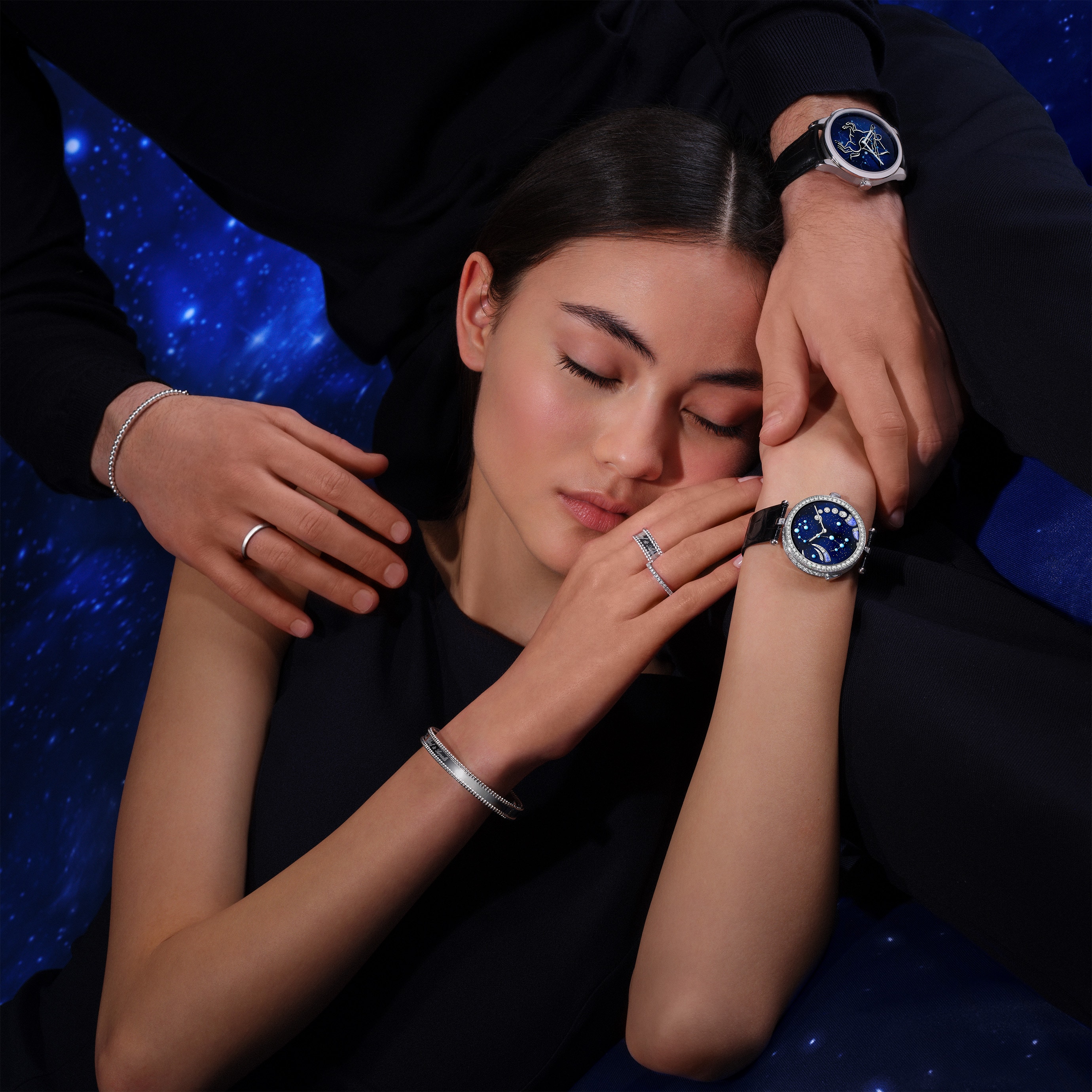 Midnight Zodiaque Lumineux Sagittarii (Sagittarius) watch, rhodium plated 18K white gold, enamel. Self-winding mechanical movement (Valfleurier), on demand lightning animation developed exclusively for Van Cleef & Arpels. Poetic Complications Collection, Van Cleef & Arpels.   Lady Arpels Zodiaque Lumineux Scorpii (Scorpio) watch, rhodium plated 18K white gold, diamonds, enamel. Self-winding mechanical movement (Valfleurier), on demand lightning animation developed exclusively for Van Cleef & Arpels. Poetic Complications Collection, Van Cleef & Arpels.   Perlée signature ring & bracelet, rhodium plated 18K white gold. Perlée Collection, Van Cleef & Arpels.    Félicité wedding band, 2.1 mm, rhodium plated 18K white gold, round diamonds. Solitaires & Wedding Bands Collection, Van Cleef & Arpels.