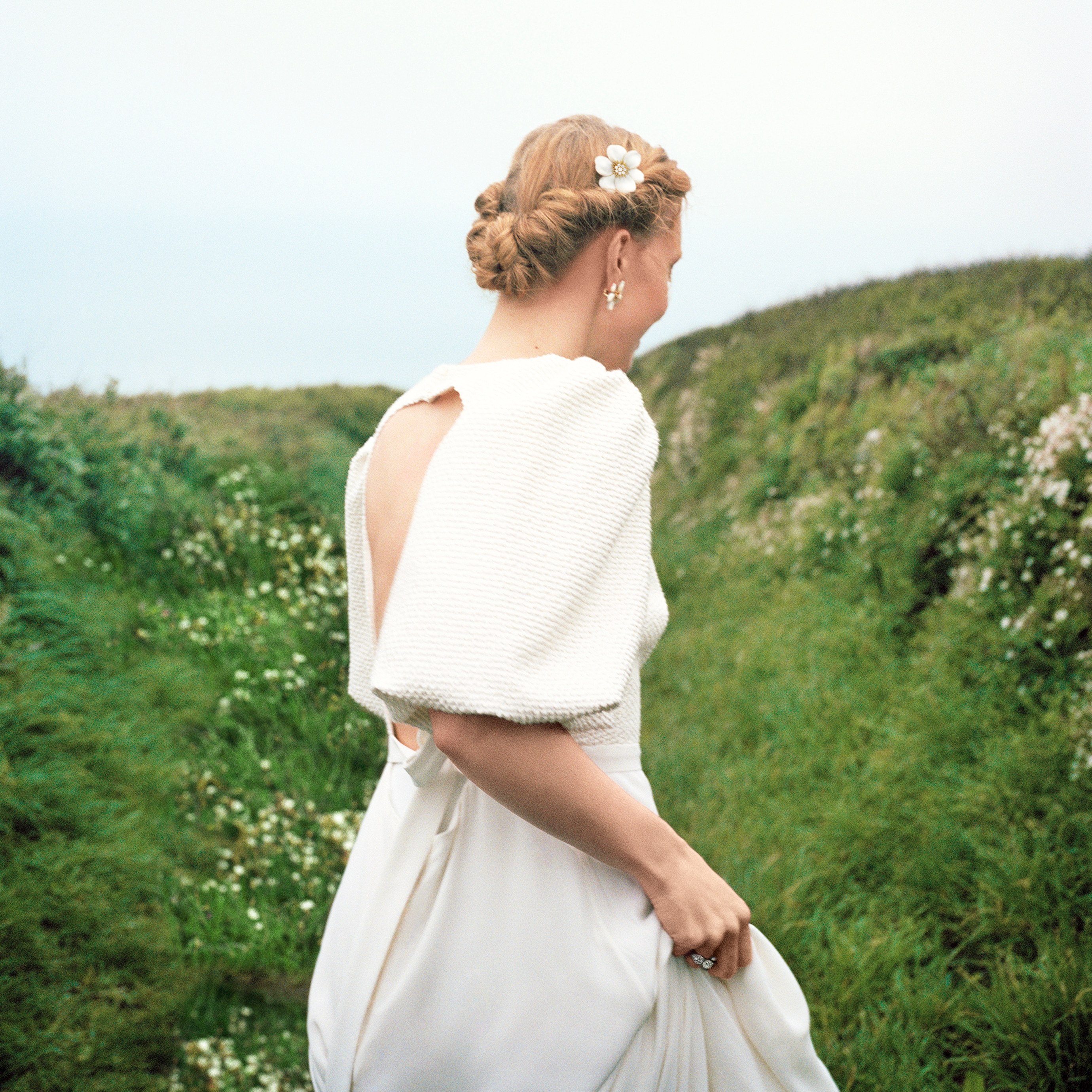 Rose de Noël earrings mini model and clip medium model, 18K yellow gold, white mother-of-pearl, diamonds. Rose de Noël collection, Van Cleef & Arpels.